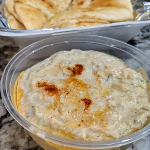 Container of baba ghanoush with pita. 8 ounces for $5.50.