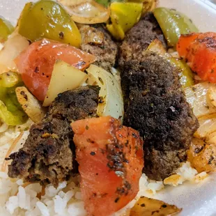 Kofta Kabob dinner entree. Marinated ground beef with grilled onions, bell pepper, and tomato over special homemade rice. $14.25.