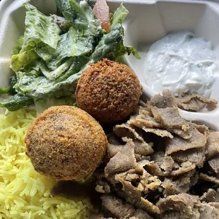 Gyro plate with tzatziki sauce and 2 falafel to go!