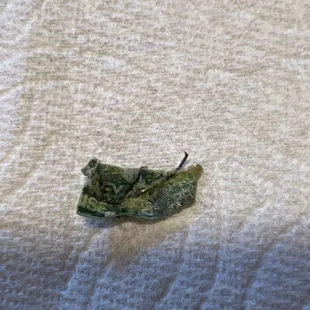 This is a piece of packaging I'm assuming from the veggies with a piece of metal that cut the roof of my mouth while eating.