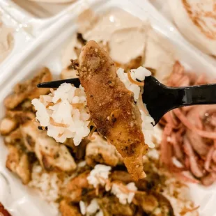 a fork holding a piece of meat