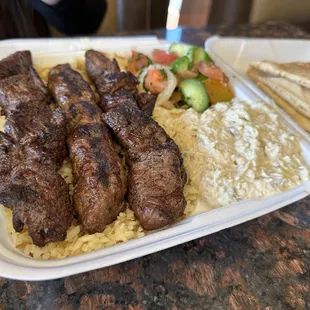 Mixed beef skewers with baba ganoush and Mediterranean salad