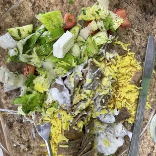 The gyro with a side salad and rice.