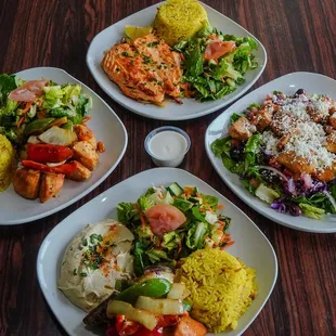 four plates of food on a table