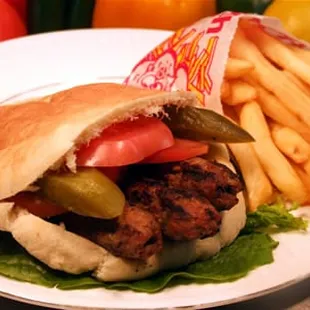 a pita hut with fries and tomatoes