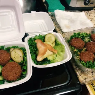 two takeout containers of food