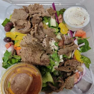 a salad in a styrofoam container