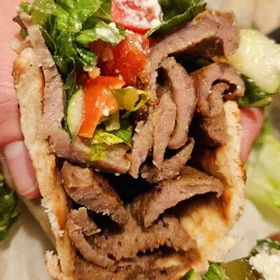 Stacks of gyro in their sandwich