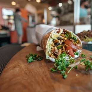 a pita wrap on a cutting board