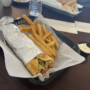 Chicken shawarma wrap with fries and the best garlic sauce ever