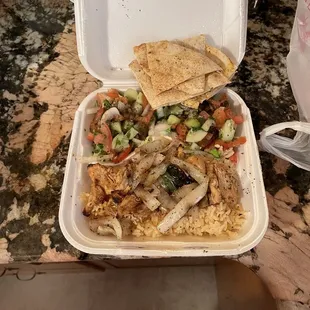 Chicken kebabs with Mediterranean salad and pita bread out of this world. Delicious.