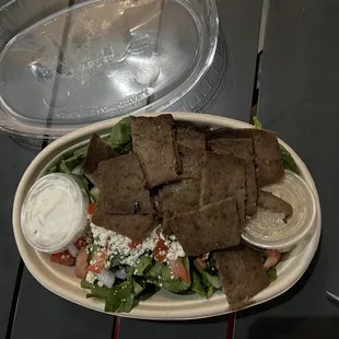 pita chips and salad on a plate