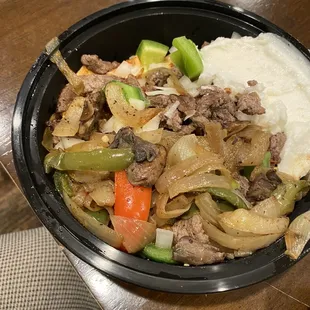 Mixed Sharmwa bowl with garlic sauce. Garlic sauce good.