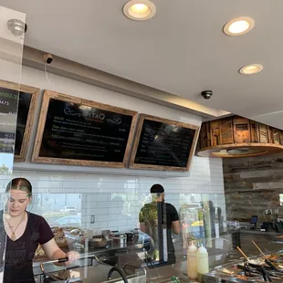 a woman preparing food in a restaurant