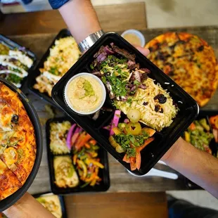 a variety of pizzas and salads