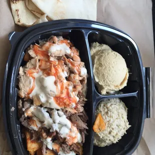 Chicken and beef, baba ghanouj, hommus and spicy potatoes under the meat