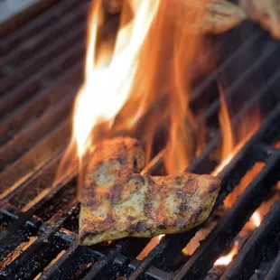 a piece of pizza on the grill