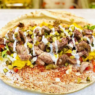 a pita with meat and vegetables