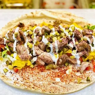 a pita with meat and vegetables