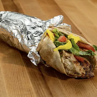 a pita sandwich wrapped in aluminum foil