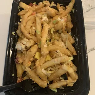 Bowl with almost no toppings. Mostly french fries.