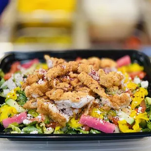 a salad in a plastic container