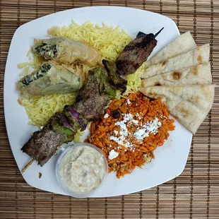 Build Your Plate with crispy fspanakopita and steak kabob.