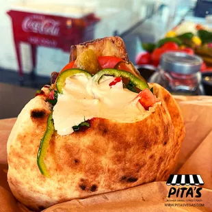 a pita filled with vegetables and cheese