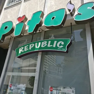 Paper over windows w/advertising of upgrades to building.Hope something fun comes for students moving to new apts opening soon next store.