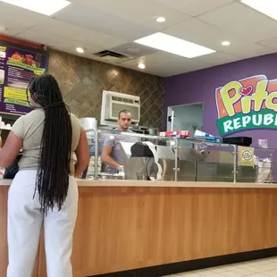 a man and a woman ordering food