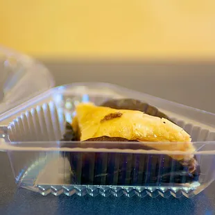 a banana and chocolate cupcake in a plastic container