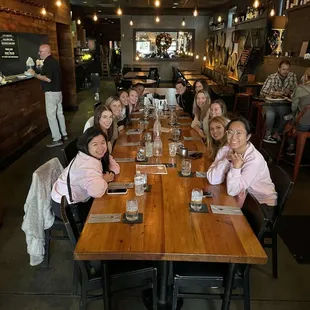 a group of people sitting at a table