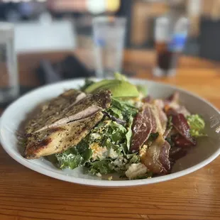 a plate of food on a wooden table