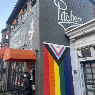 a man standing in front of a store