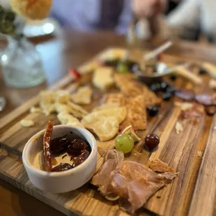 Half eaten large Charcuterie board--plenty for 8 to share.