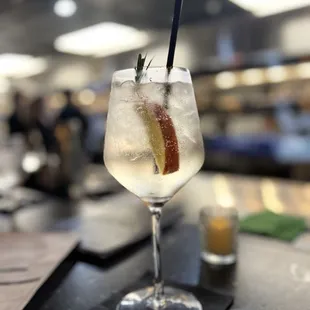 a gin cocktail in a wine glass