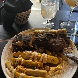 a plate of food and a glass of water