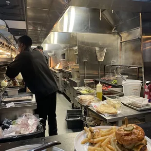 a man preparing food in a commercial kitchen