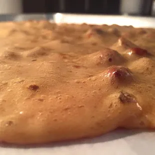 a pancake covered in sauce