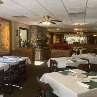 a dining room with tables and chairs