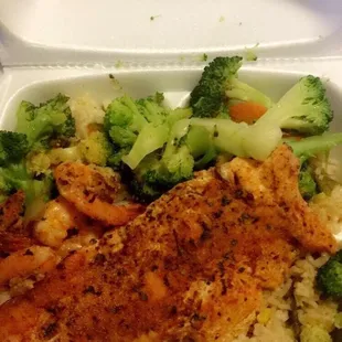 Shrimps and salmon with vegetables and vegetable fried rice
