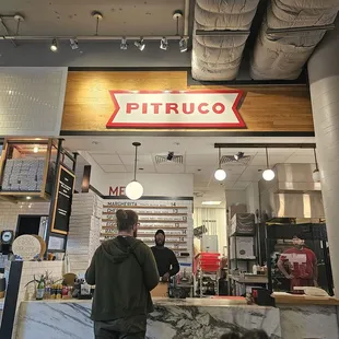 a man standing in front of the counter