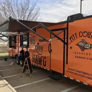 a man standing in front of a food truck