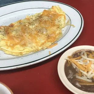 an omelet and a bowl of soup