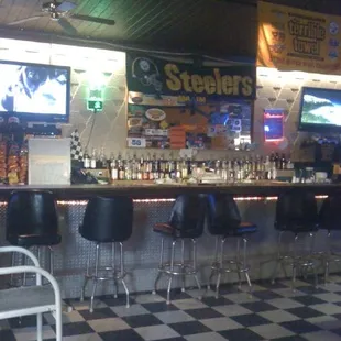 a bar with black and white checkered floor