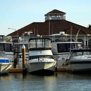 a row of boats docked at a dock