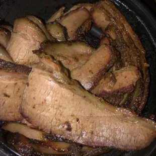 a pan full of beef and mushrooms