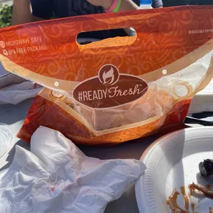a bag of bread and a plate of bacon