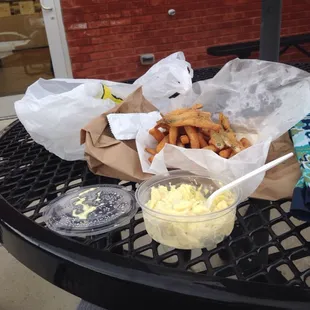 Smelt , fries, potato salad.