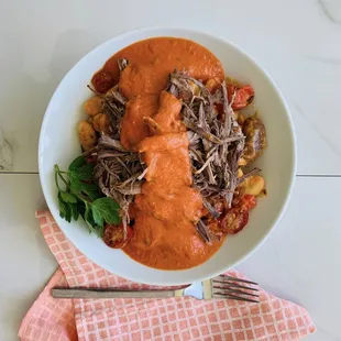 a bowl of stew with meat and vegetables